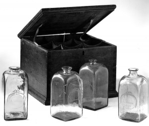 Case bottle, 1973.357, with other bottles and case